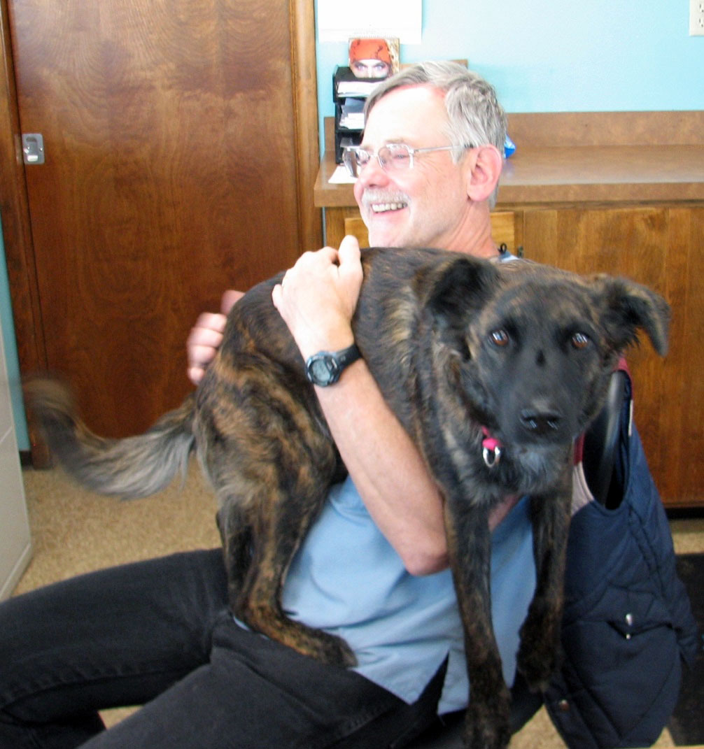 Dr. Detwiler and Bandit consulting with a client.